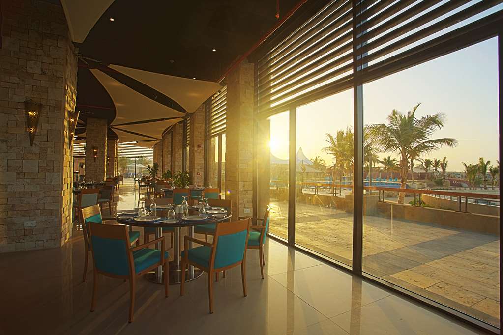 Golden Tulip Sharma Resort Nhà hàng bức ảnh