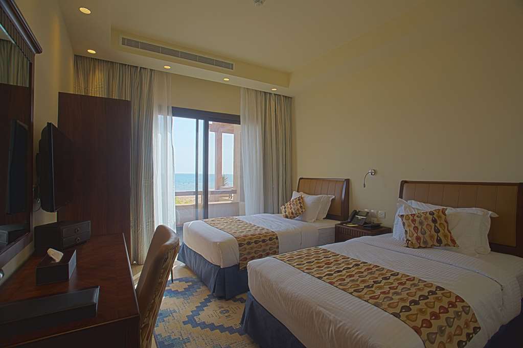 Golden Tulip Sharma Resort Phòng bức ảnh