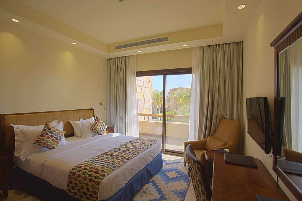 Golden Tulip Sharma Resort Phòng bức ảnh