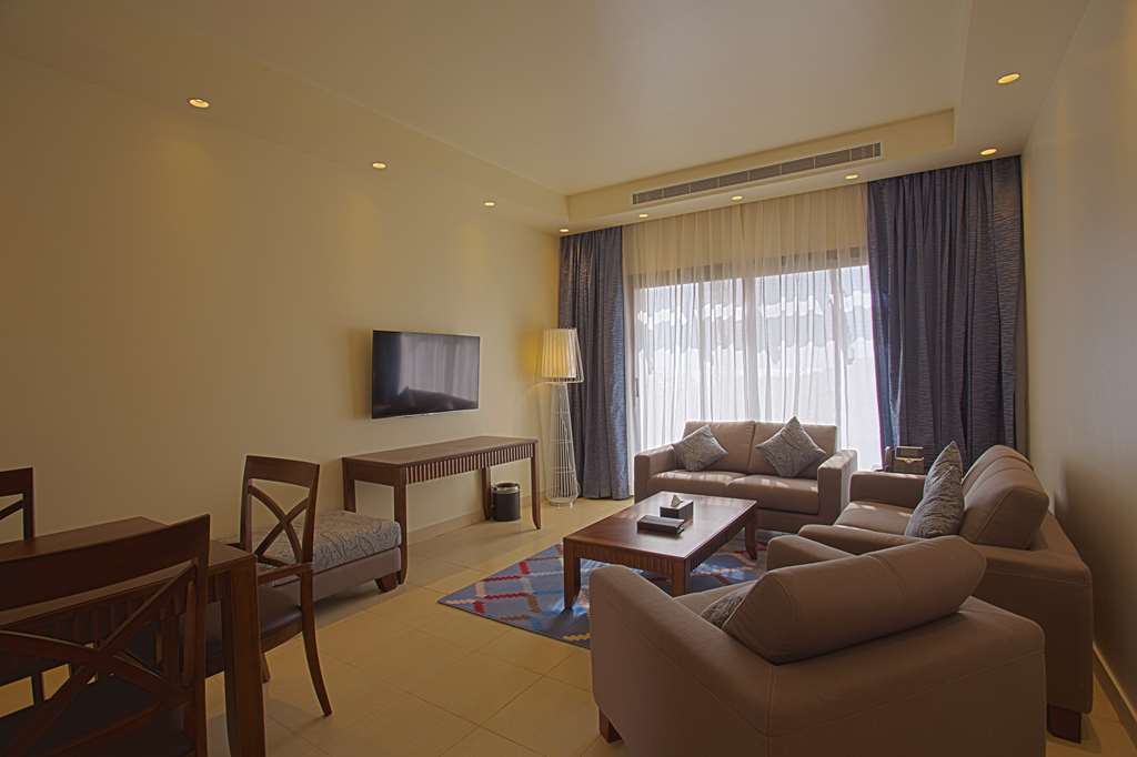 Golden Tulip Sharma Resort Phòng bức ảnh
