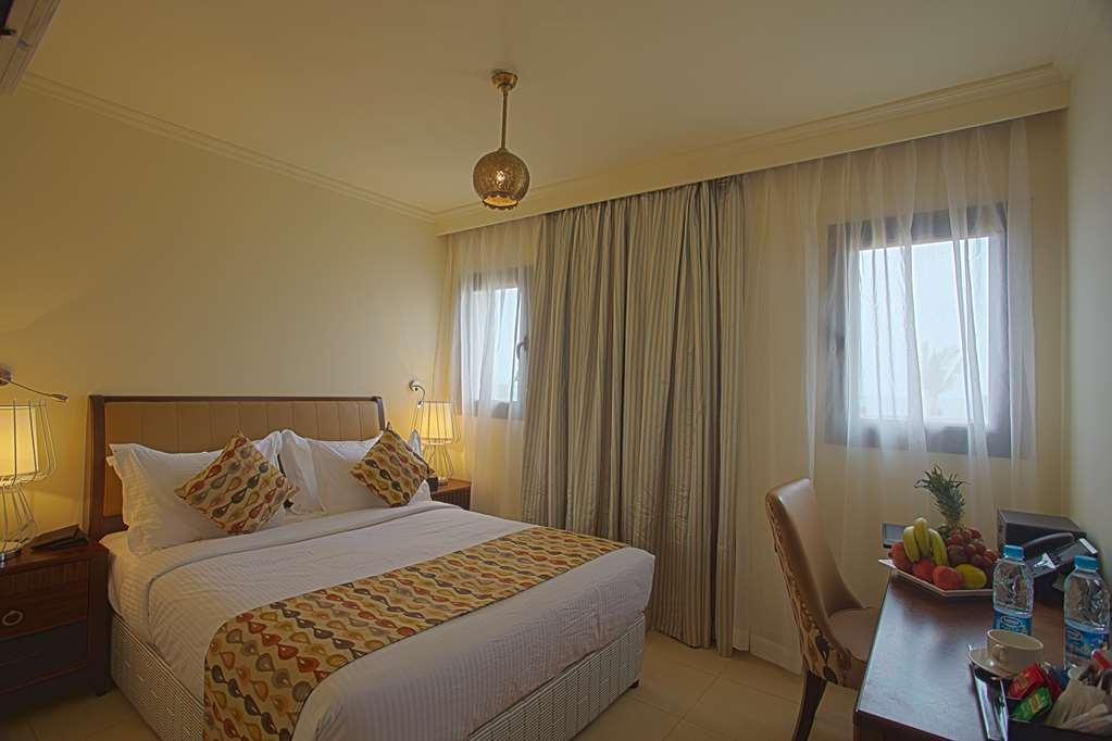 Golden Tulip Sharma Resort Phòng bức ảnh